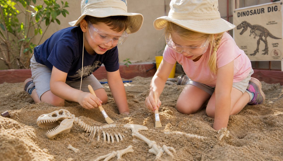 Young children doing a backyard fossil dig